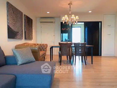 Spacious living room with elegant dining area and modern decor