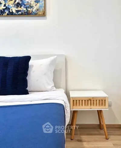 Stylish bedroom with modern decor and cozy bedding