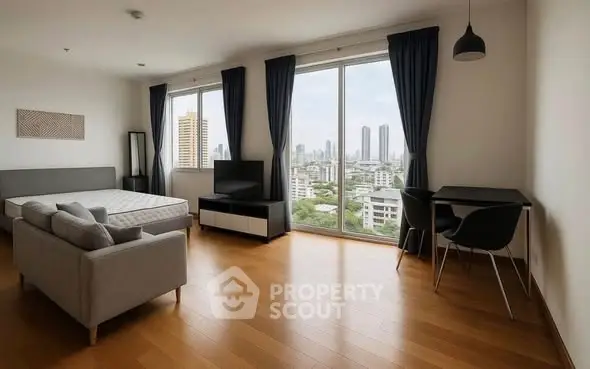 Spacious modern bedroom with city view and stylish furnishings.