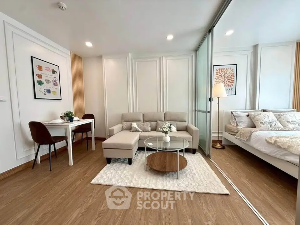 Modern open-plan living room with cozy seating and elegant decor