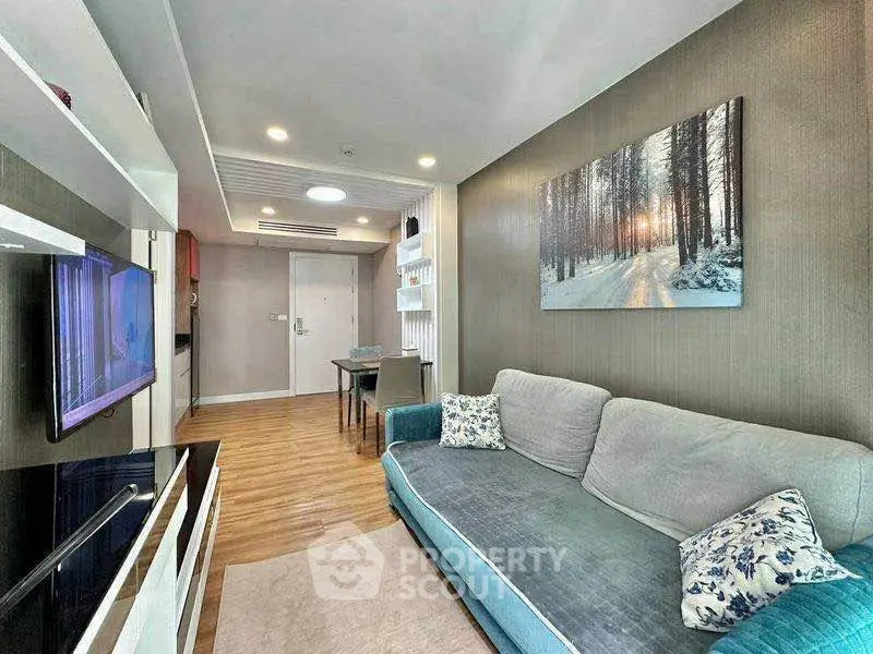 Modern living room with cozy sofa and stylish decor in a contemporary apartment.
