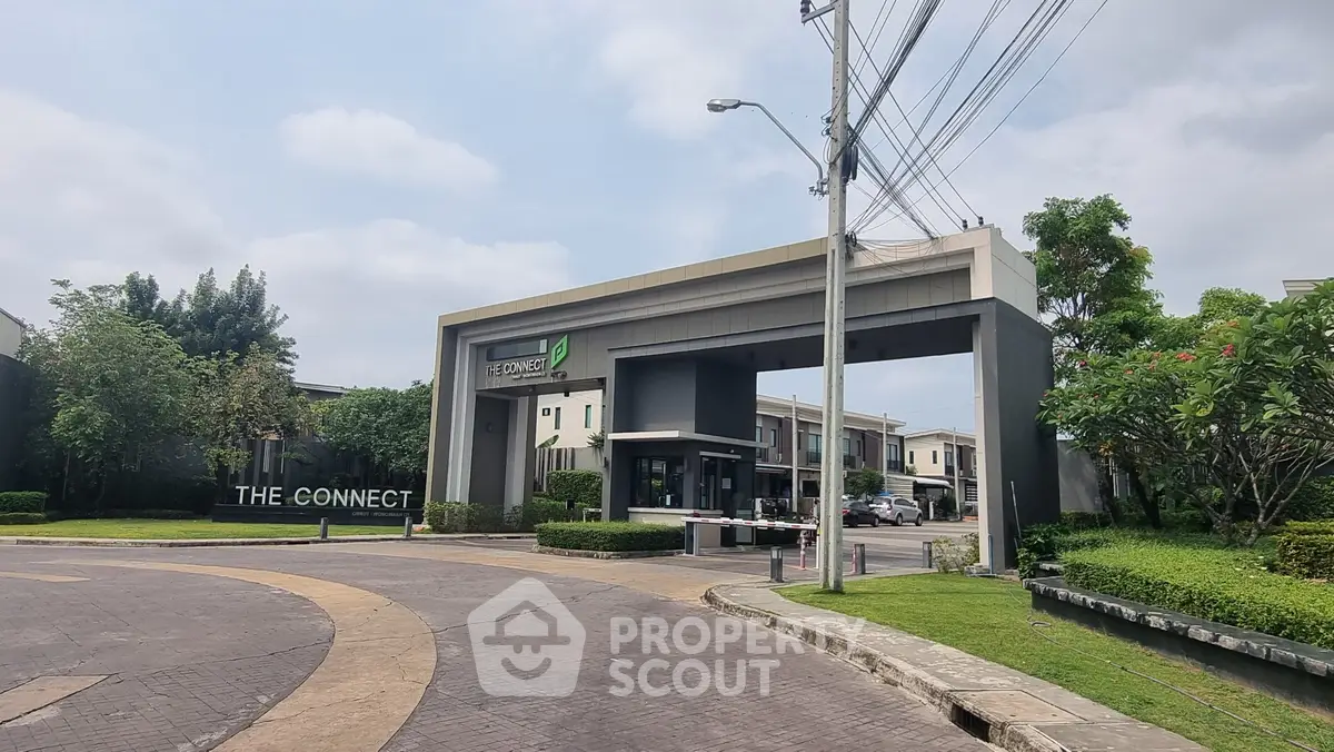 Modern residential entrance with lush greenery and contemporary design at The Connect.