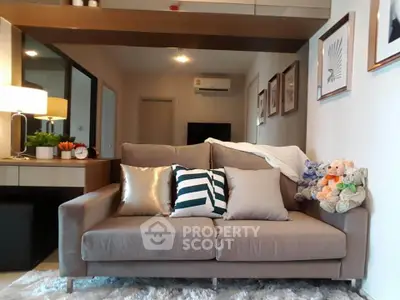 Stylish living room with cozy sofa and modern decor in a contemporary apartment.