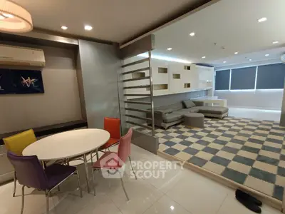 Modern living room with colorful chairs and checkered flooring