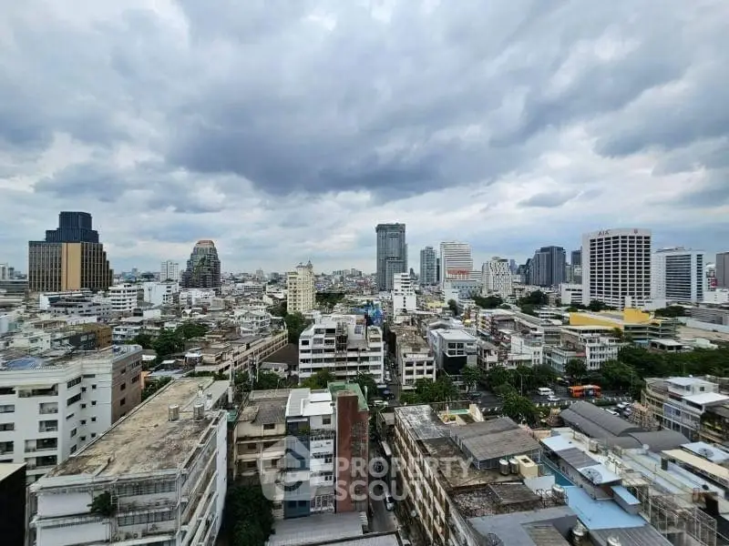 Stunning cityscape view showcasing urban skyline with dramatic clouds overhead.