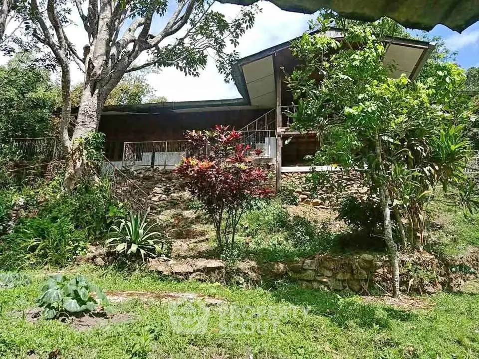 Charming hillside home with lush garden and spacious balcony, perfect for nature lovers seeking tranquility.