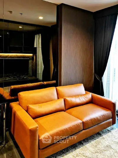 Luxurious living room with elegant brown leather sofa and floor-to-ceiling windows.