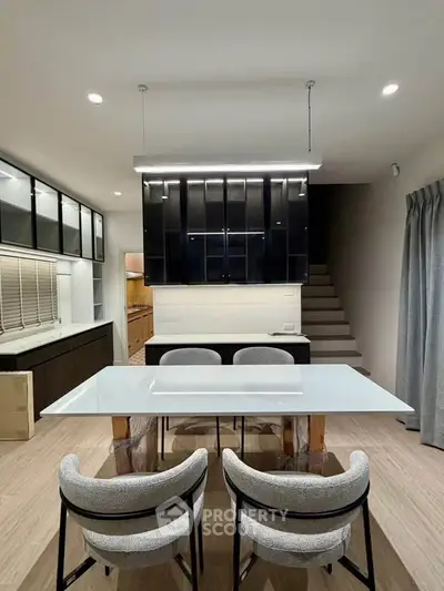 Modern kitchen with sleek cabinetry and stylish dining area