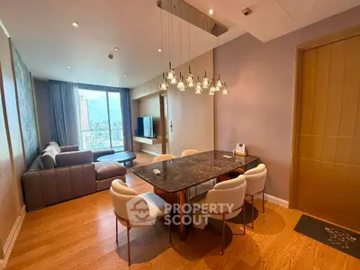 Spacious modern living room with city view, elegant dining area, and stylish lighting in luxury apartment.