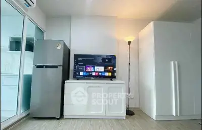 Modern living room with sleek TV setup and stylish storage solutions.