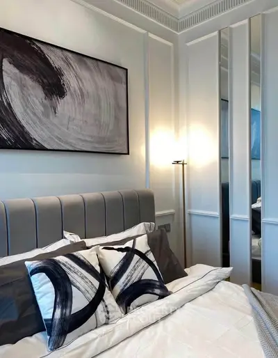 Elegant bedroom with modern art and stylish decor