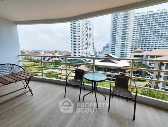 Spacious balcony with stunning city view, perfect for relaxation and outdoor dining.