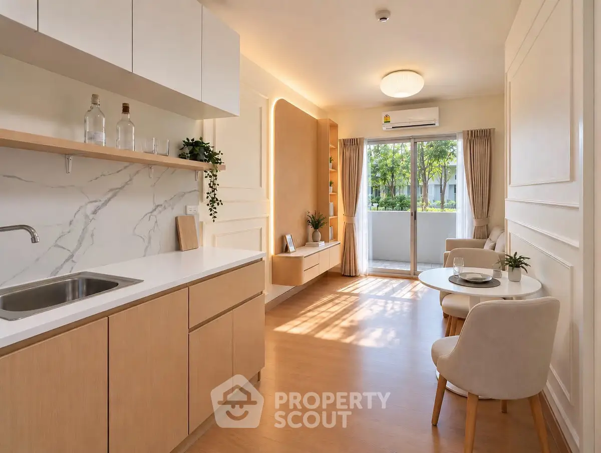 Modern open-plan kitchen and living room with natural light and stylish decor.