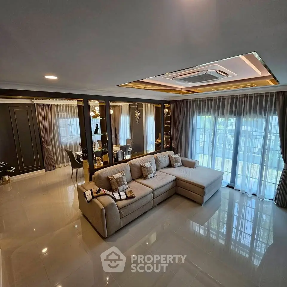 Luxurious living room with elegant decor and large windows for natural light