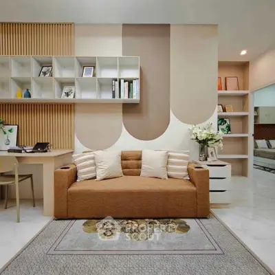Stylish living room with modern decor and cozy seating area, perfect for relaxation and productivity.