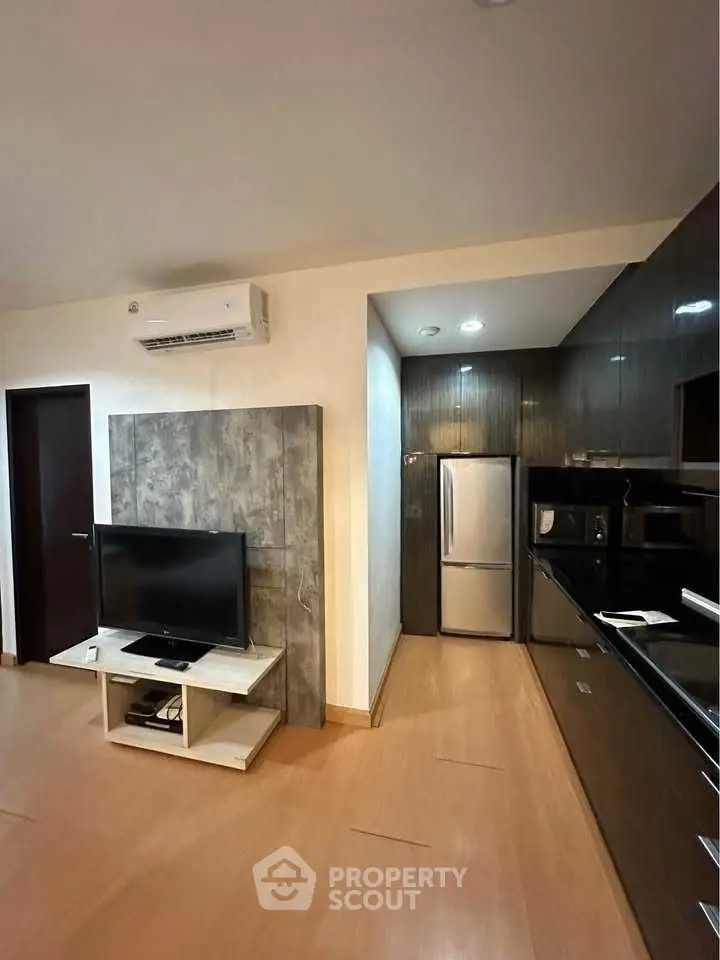 Modern apartment interior with sleek kitchen and cozy living area
