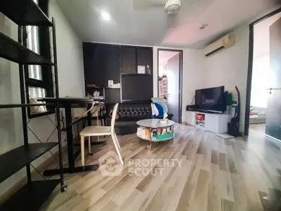 Modern living room with sleek furniture and stylish flooring, perfect for urban living.
