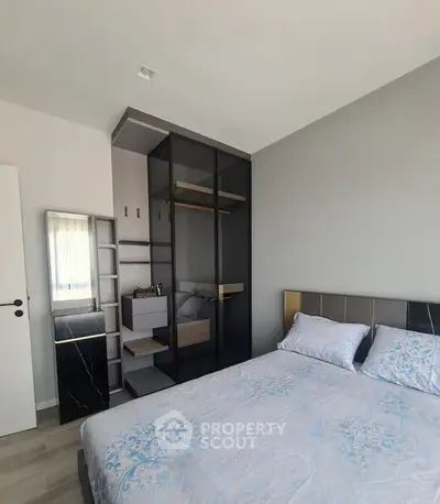 Modern bedroom with stylish decor and built-in closet