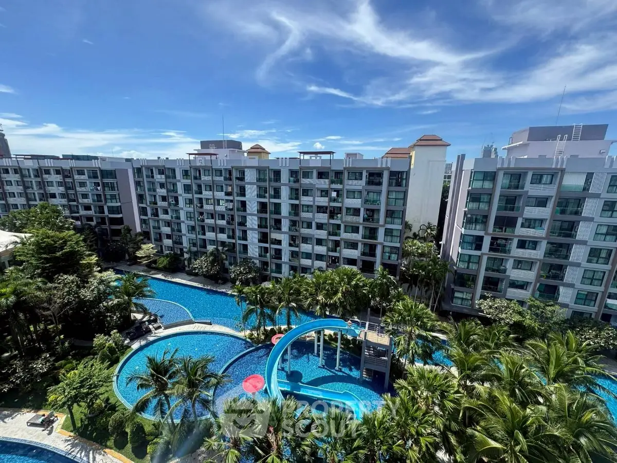 Luxurious condominium with stunning pool and lush greenery view