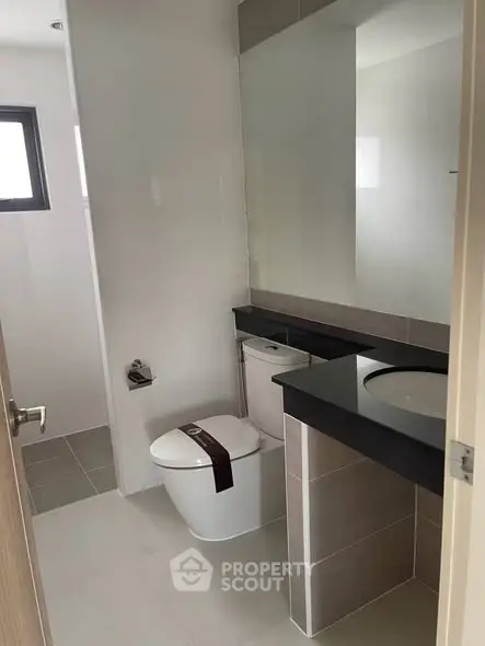 Modern bathroom with sleek design and large mirror