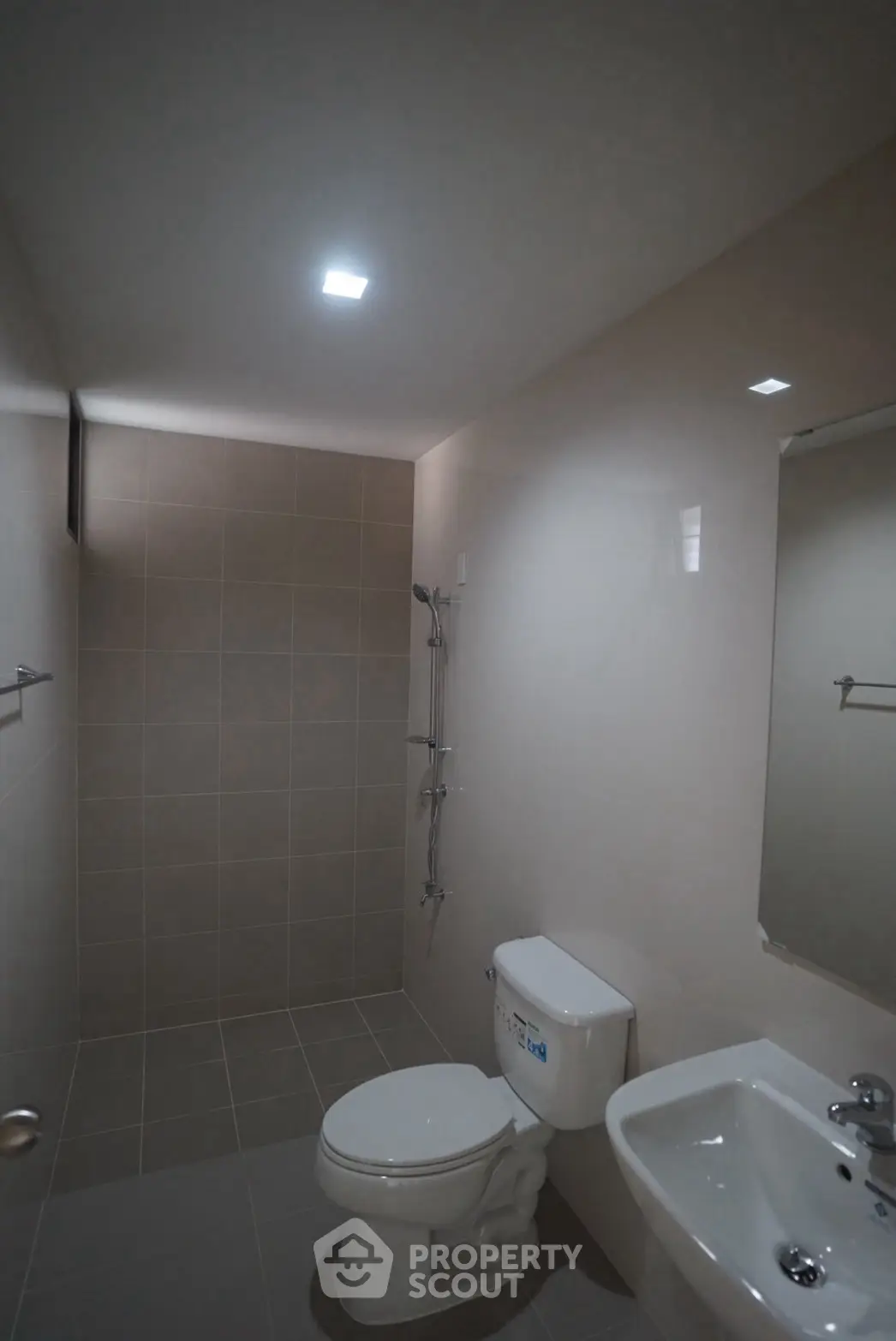 Modern bathroom with sleek fixtures and neutral tiles, perfect for a minimalist home design.
