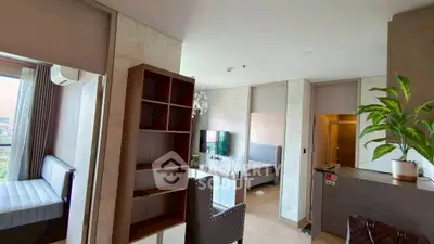 Modern apartment interior with stylish furniture and open layout, featuring a cozy living area and bedroom.