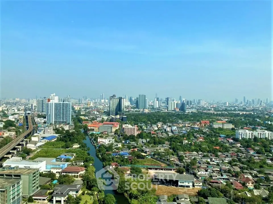 Stunning panoramic cityscape view showcasing urban skyline and lush greenery, perfect for real estate investment.
