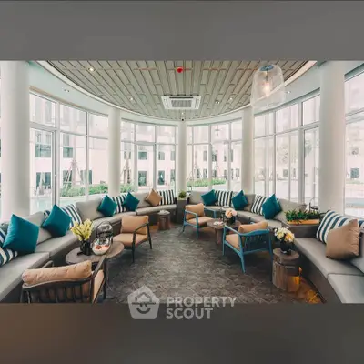 Luxurious modern lounge area with panoramic windows and stylish seating in a high-end building.