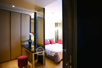 Luxurious bedroom with elegant decor and modern furnishings in a stylish apartment.