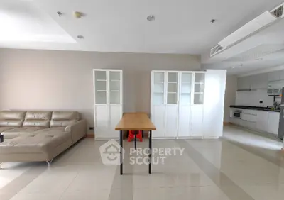 Spacious modern living room with sleek kitchen open layout and elegant furnishings