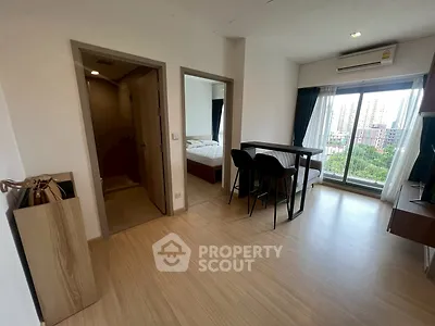 Modern apartment with open layout and city view from large window