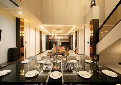 Luxurious modern dining area with elegant decor and open layout, perfect for entertaining guests.