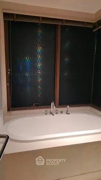 Luxurious bathroom with modern bathtub and stylish window design