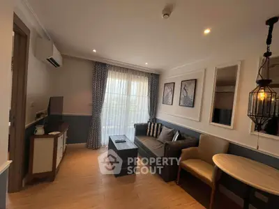Charming living room with elegant decor, cozy seating, and natural light for a welcoming ambiance.