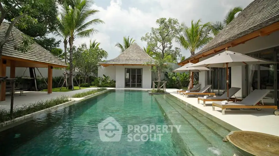 Luxurious tropical villa with private pool and lush garden, perfect for serene relaxation and upscale living.