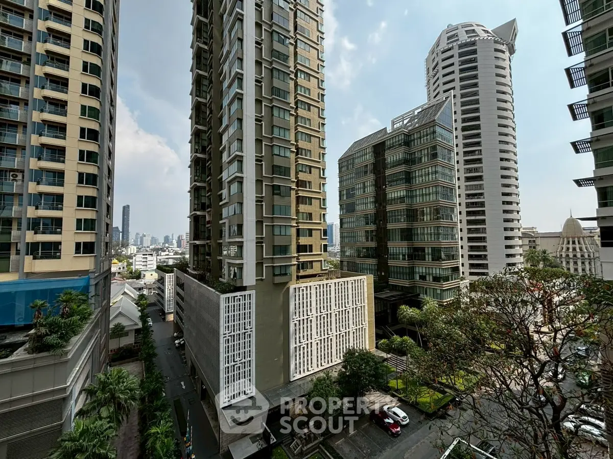 Stunning urban high-rise buildings with modern architecture and lush greenery in a vibrant cityscape.