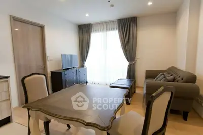 Elegant living room with stylish furniture and natural light, perfect for relaxation and entertainment.