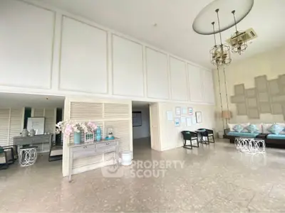 Spacious and elegant lobby with modern decor and comfortable seating area.