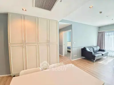 Spacious living room with modern decor and ample natural light