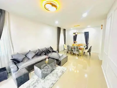 Spacious modern living room with elegant dining area and stylish decor