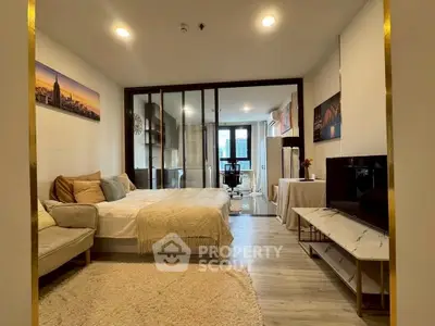 Modern studio apartment with open layout, cozy living area, and stylish decor.