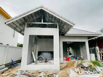 Modern house under construction with open layout and metal roof