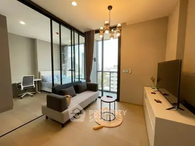 Modern living room with stylish decor and city view, featuring a cozy sofa and elegant lighting.