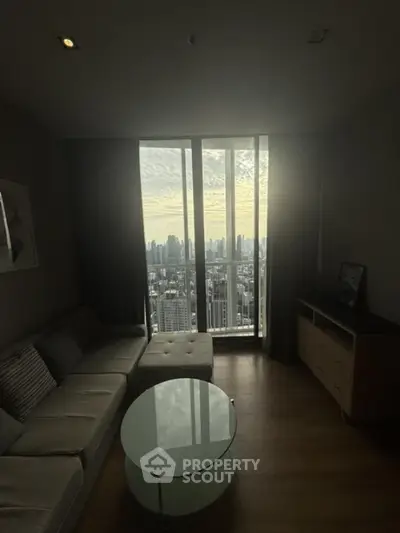Modern living room with stunning city view from high-rise apartment