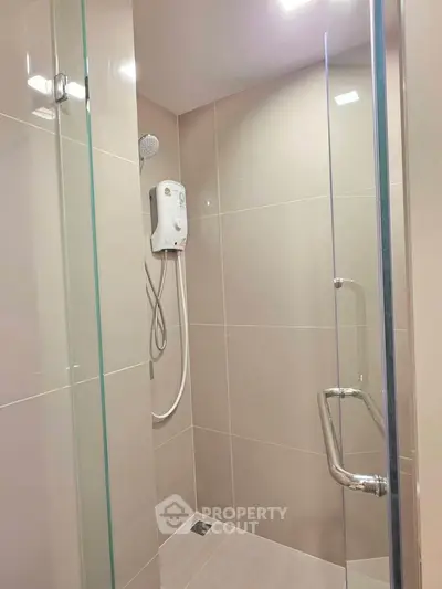 Modern bathroom shower with glass enclosure and sleek fixtures