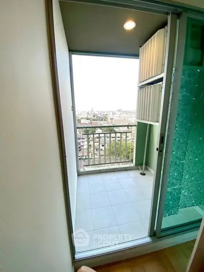 Modern apartment balcony with city view and sleek design