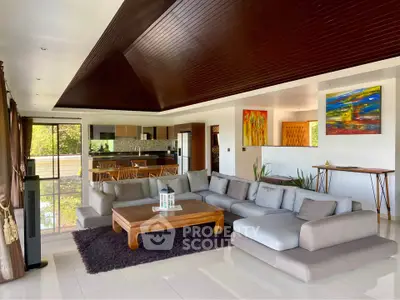 Spacious modern living room with open kitchen and stylish decor