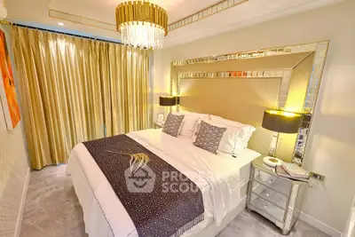 Luxurious bedroom with elegant decor and mirrored accents, featuring a plush bed and ambient lighting.