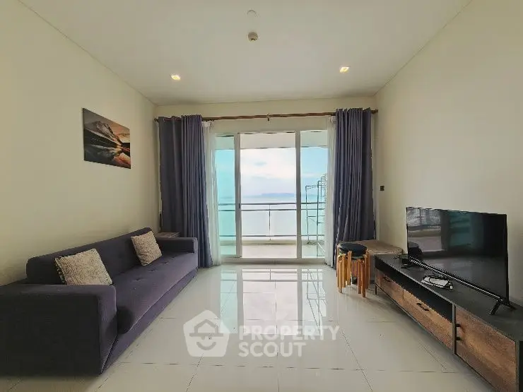 Spacious living room with modern decor and stunning balcony view