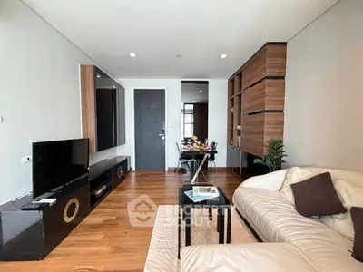 Modern living room with sleek furniture and wooden flooring